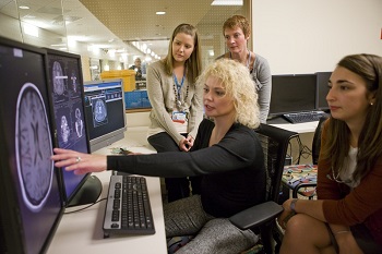 nursing students looking at scans on a screen