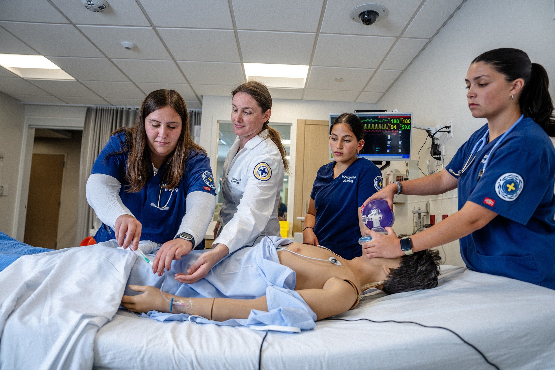 A group is engaging in a nursing simulation.