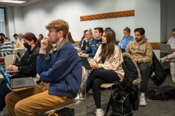 Students talking around a table