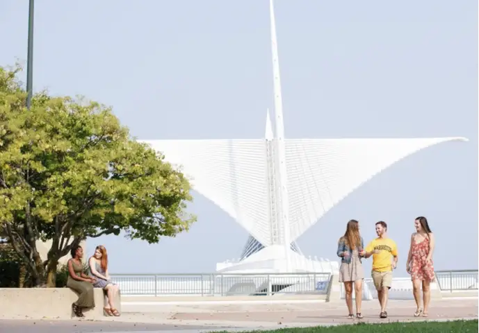 Three students take a walk near the Milwaukee Art Museum