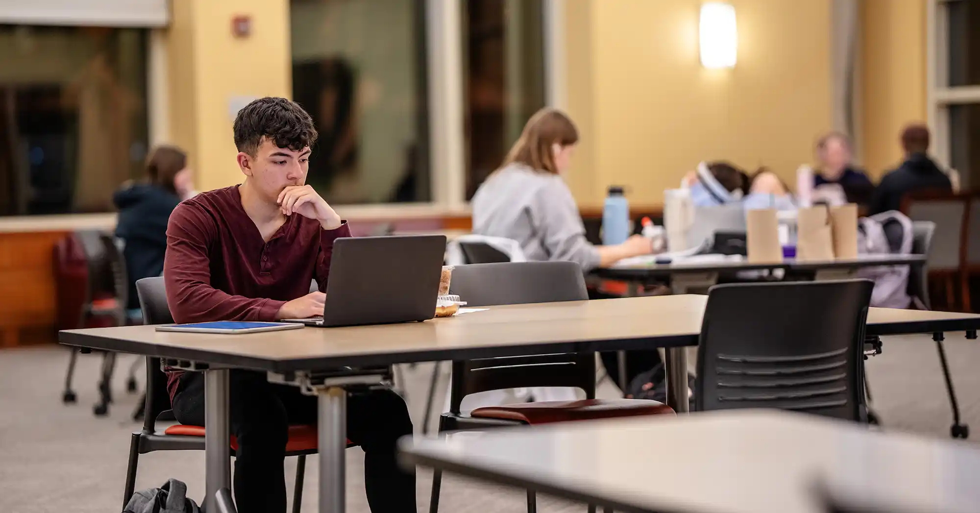 student with hand in palm thinking