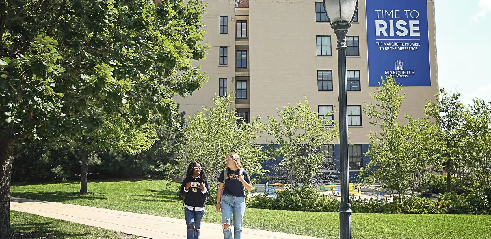 two students walk around campus