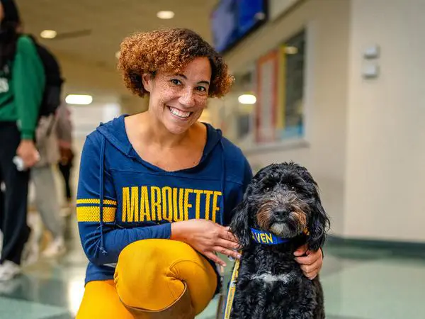 marquette student with assistant dog 