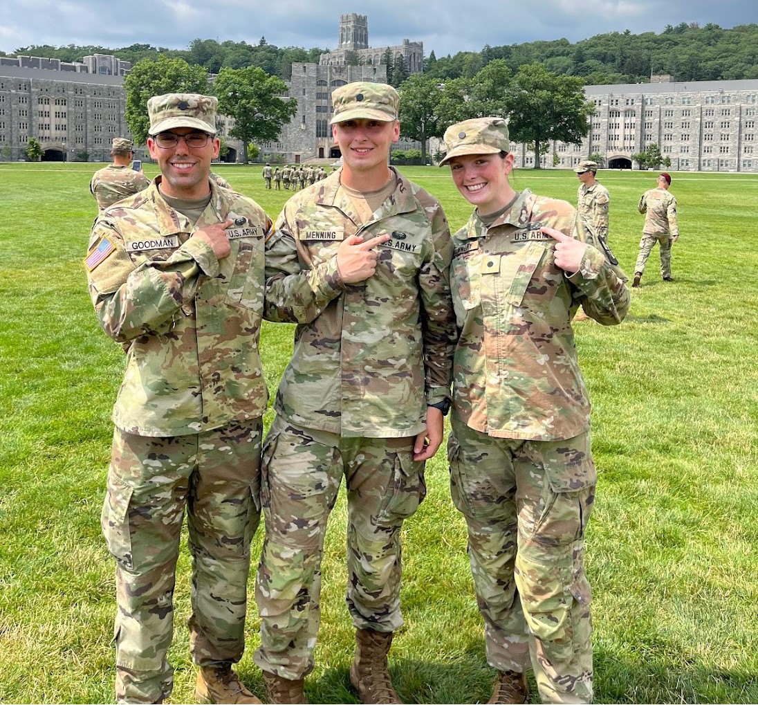 Three cadets point to their new badge after completing Army Air Assault school