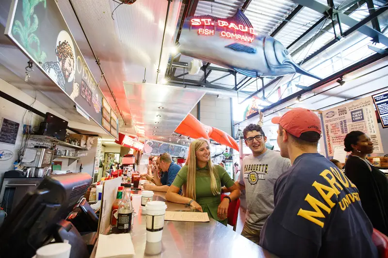 students sharing meal at milwaukee public market