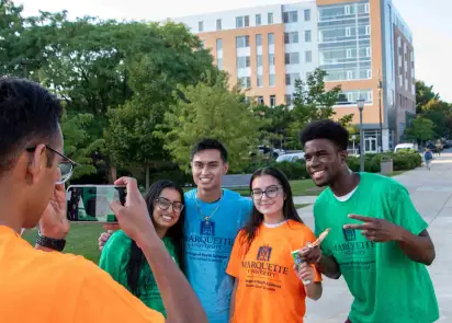 students pose for group photo after day of service 