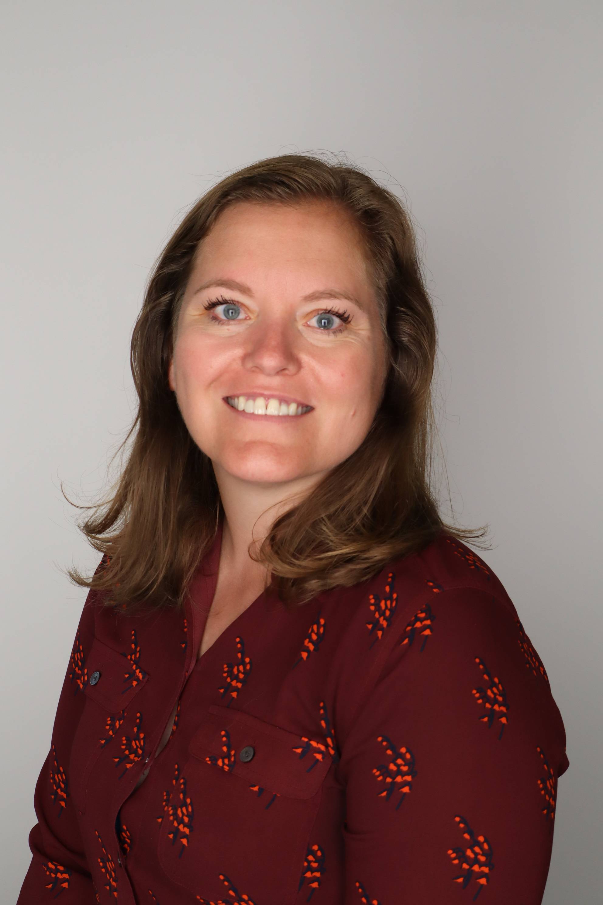 a career counselor smiles for a professional headshot