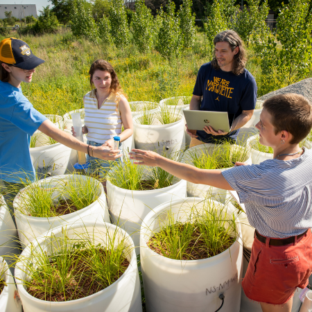 students collaborating at a green infrastructure site