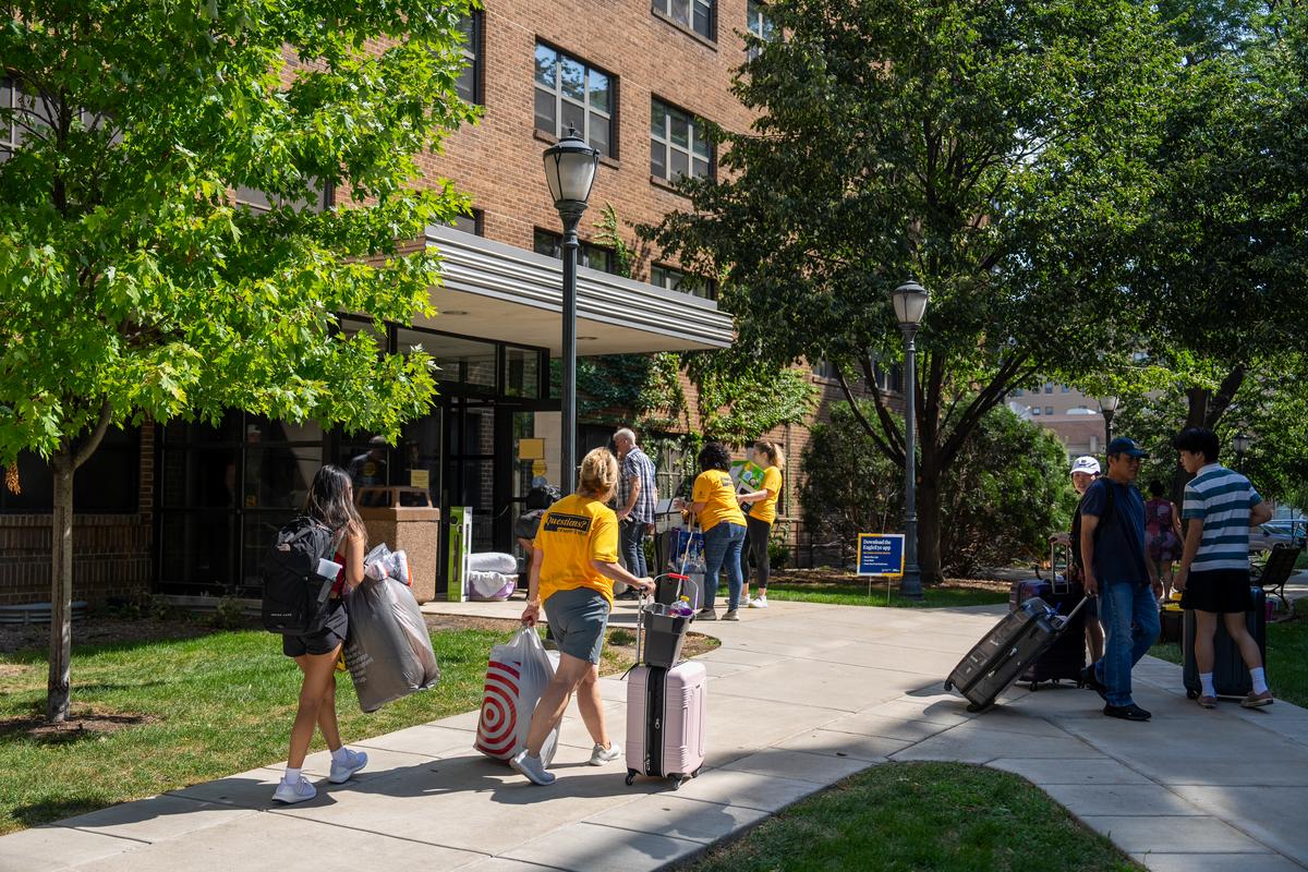 Students moving into a residence hall