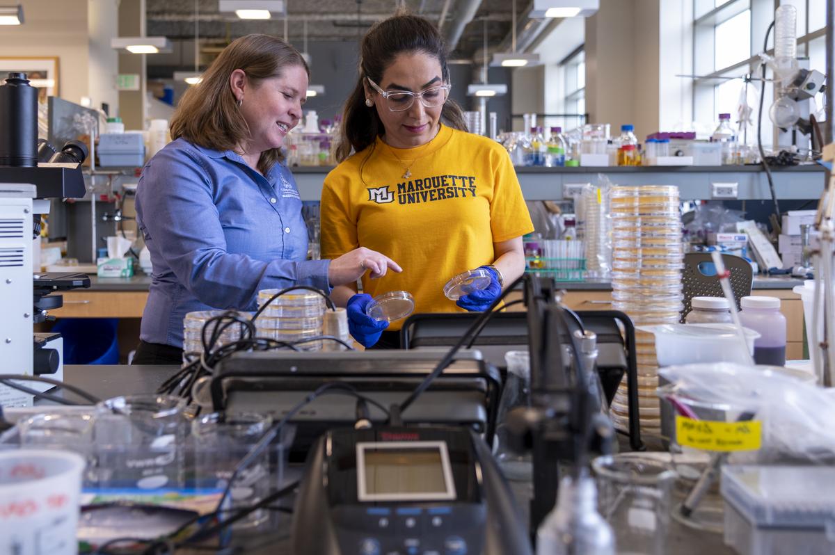 Dr. Brooke Mayer working with a student on water research